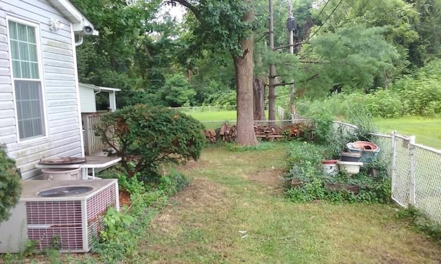 view of yard with central AC