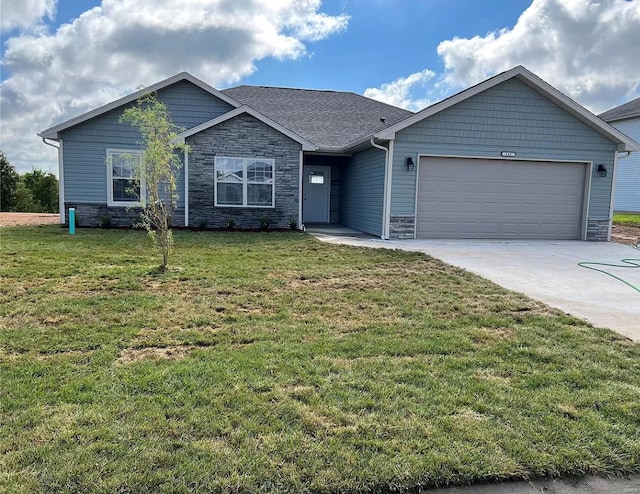 single story home with a garage and a front yard