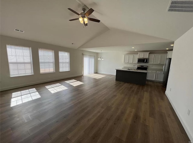 unfurnished living room featuring lofted ceiling, ceiling fan, dark hardwood / wood-style floors, and sink