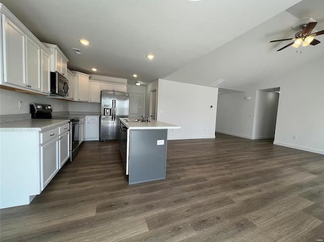 kitchen with ceiling fan, white cabinetry, a center island with sink, and stainless steel appliances