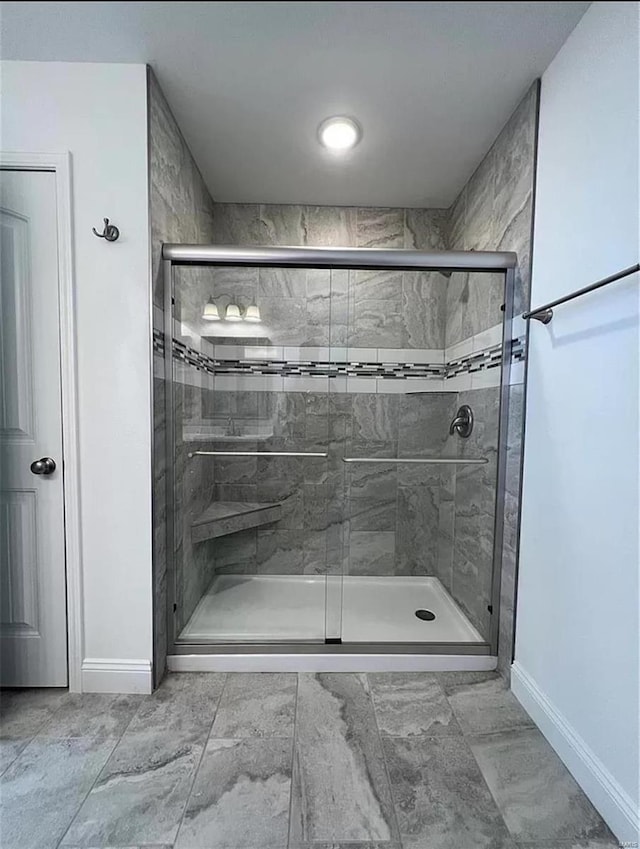 bathroom featuring an enclosed shower