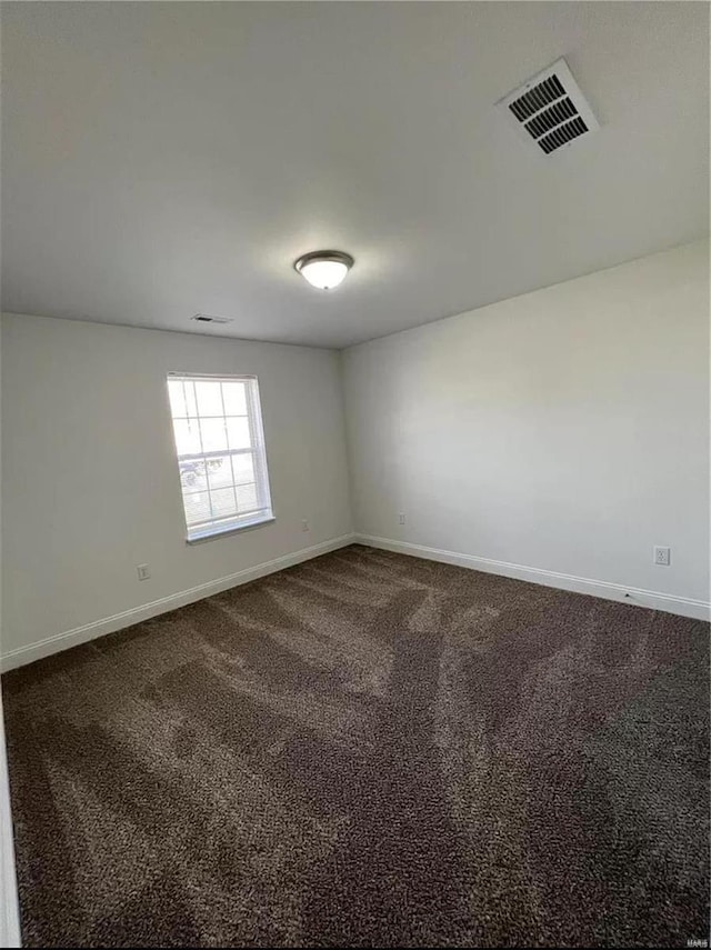 empty room with carpet flooring