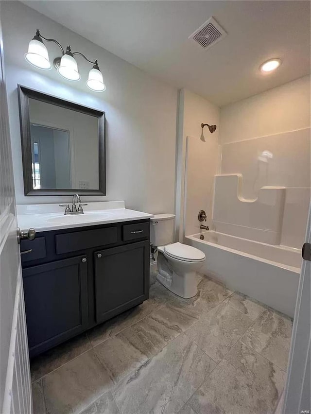 full bathroom featuring toilet, tub / shower combination, and vanity