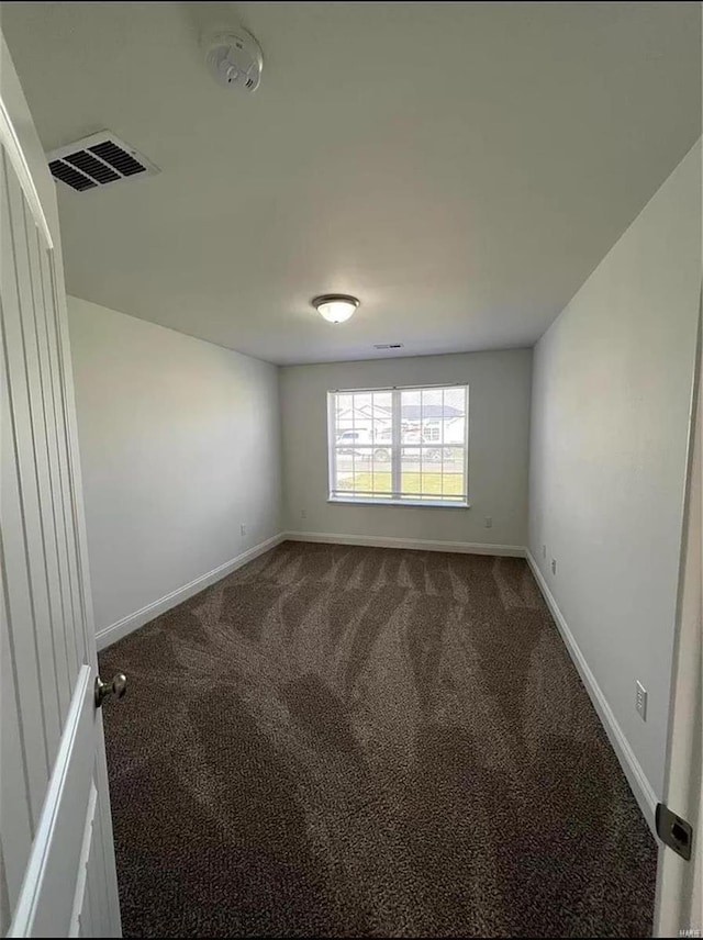 spare room featuring carpet flooring