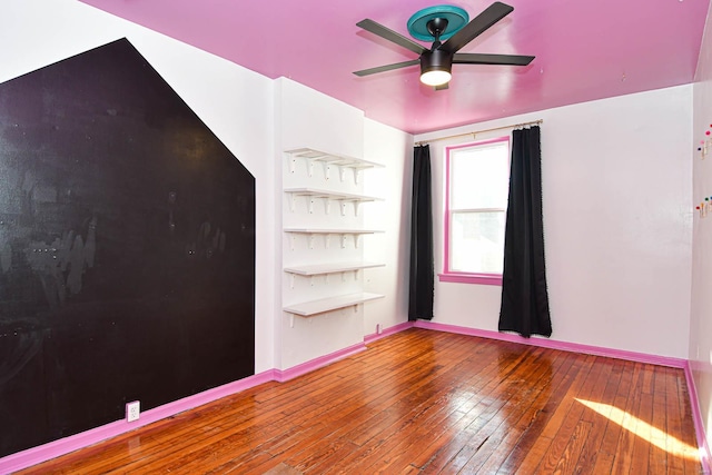 spare room featuring ceiling fan and wood-type flooring