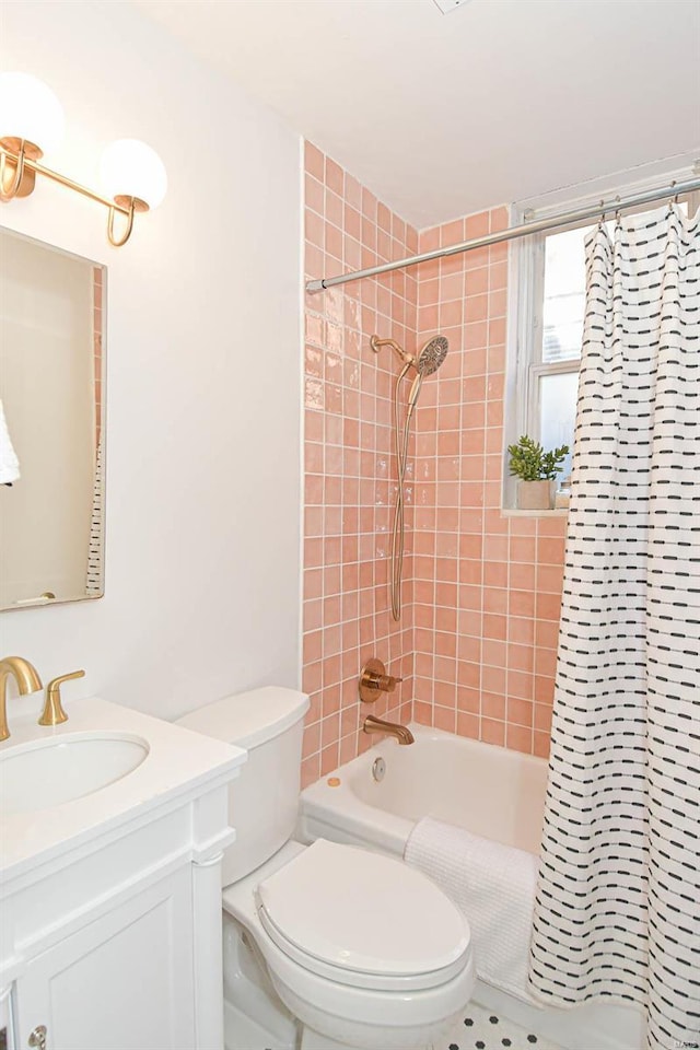 full bathroom featuring vanity, toilet, and shower / tub combo