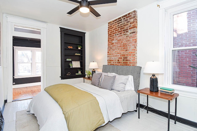 bedroom featuring ceiling fan and light wood-type flooring