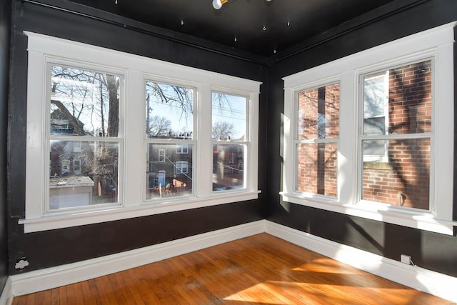 unfurnished sunroom featuring plenty of natural light