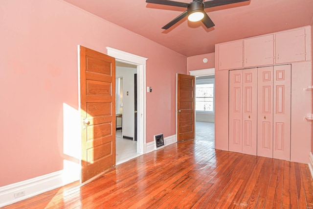 unfurnished bedroom with a closet, ceiling fan, and light hardwood / wood-style flooring