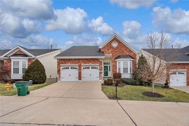 view of front of home with a garage and a front yard