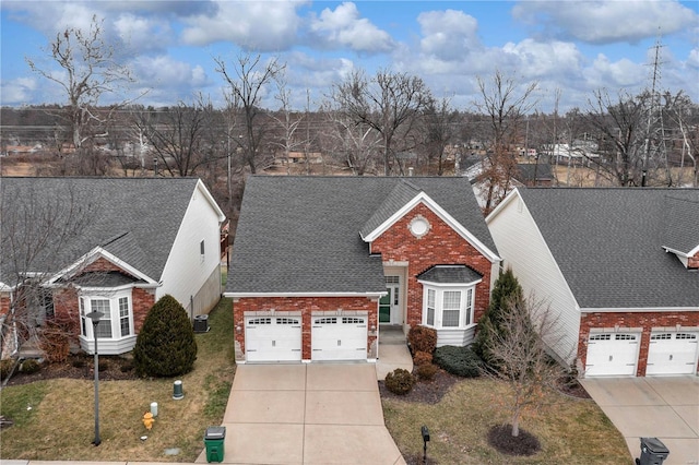 view of front facade with a garage and a front lawn