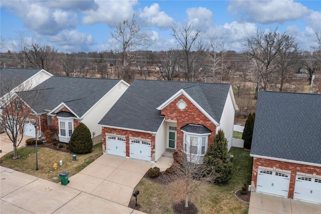 view of front of home with a garage and a front yard