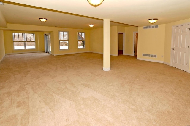 empty room with light colored carpet