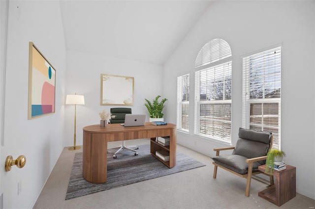 home office with carpet floors and vaulted ceiling