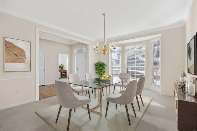 dining area featuring crown molding, light carpet, baseboards, and a notable chandelier