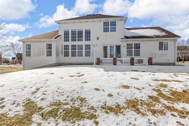 view of snow covered house