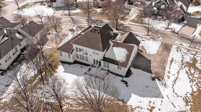 snowy aerial view featuring a residential view