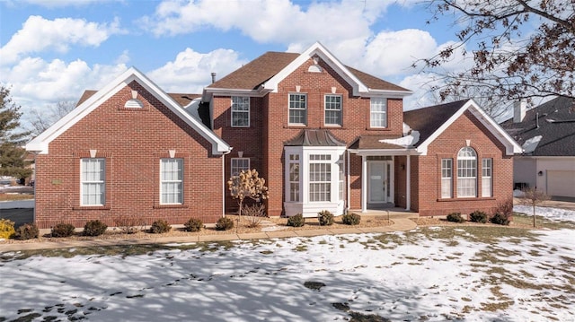 view of front of home with brick siding