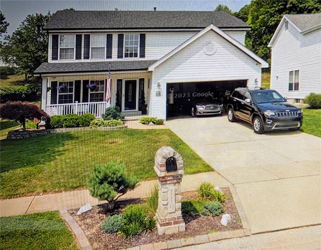 view of front of property with covered porch, a front yard, and a garage