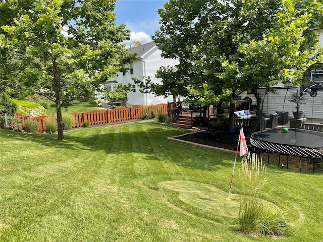 view of yard with a trampoline