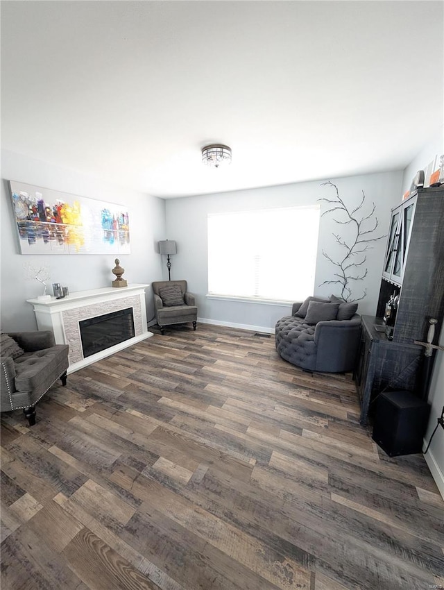 sitting room with dark hardwood / wood-style flooring