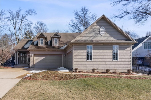 view of front of home featuring a garage and a front yard