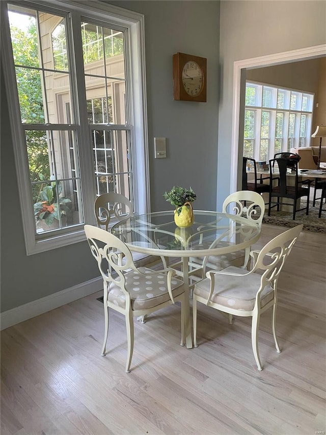 dining area with light wood-type flooring