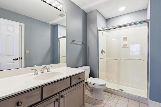 bathroom with walk in shower, tile patterned floors, toilet, and vanity