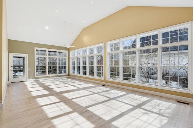 unfurnished sunroom with lofted ceiling and ceiling fan