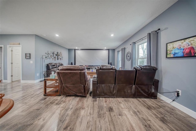 home theater room featuring light hardwood / wood-style floors