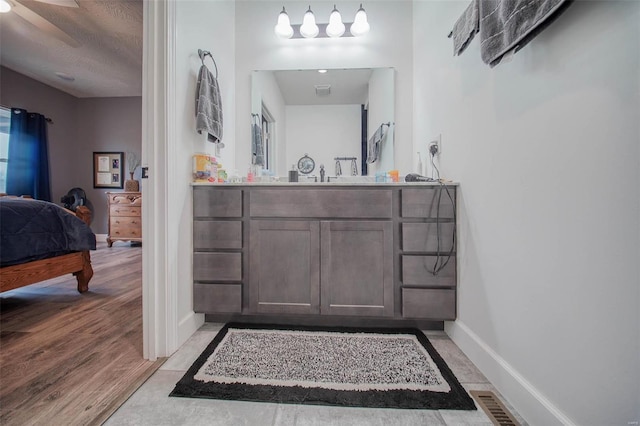 bathroom featuring vanity and wood-type flooring