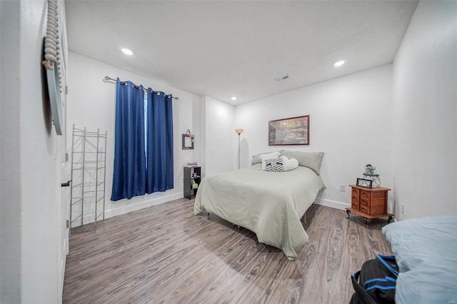 bedroom featuring wood-type flooring