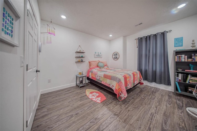 bedroom featuring hardwood / wood-style flooring