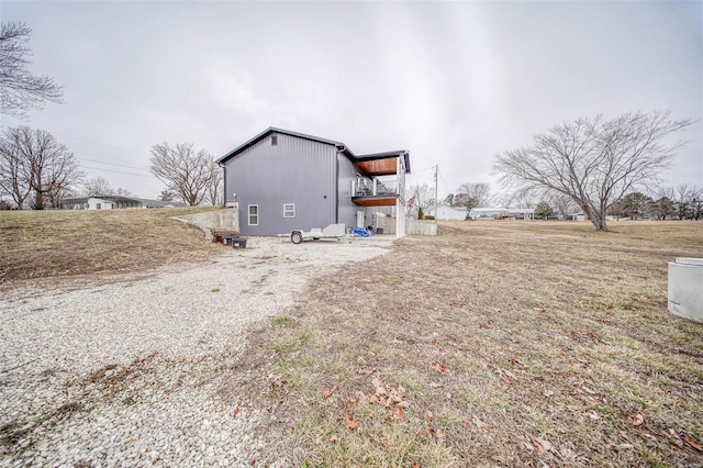 view of home's exterior with a yard