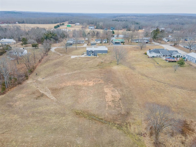 birds eye view of property featuring a rural view