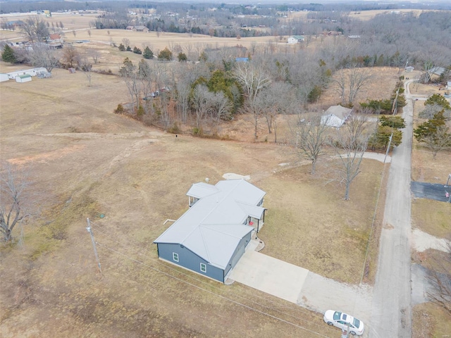 birds eye view of property with a rural view