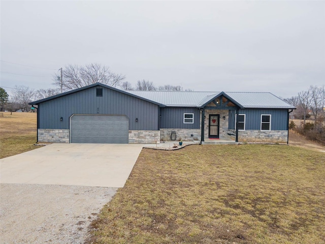 view of front of property with a garage and a front yard