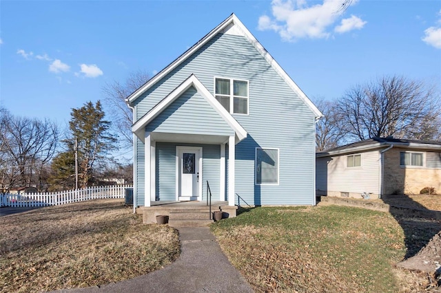 front of property featuring a front yard and central AC unit