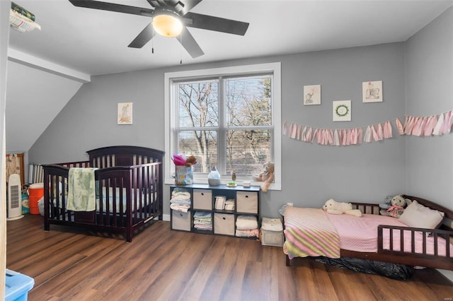 bedroom featuring lofted ceiling, dark wood-type flooring, and ceiling fan