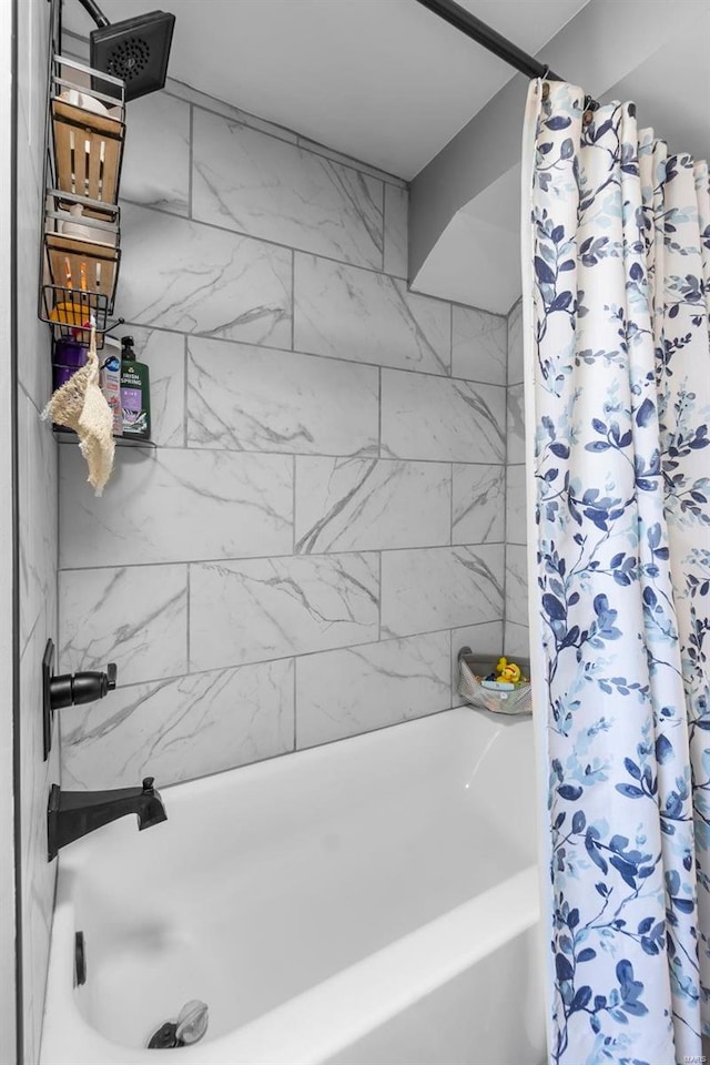 bathroom featuring shower / bathtub combination with curtain