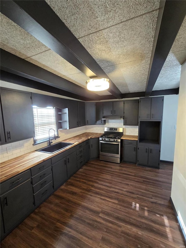 kitchen with sink, stainless steel gas range, dark hardwood / wood-style floors, and decorative backsplash