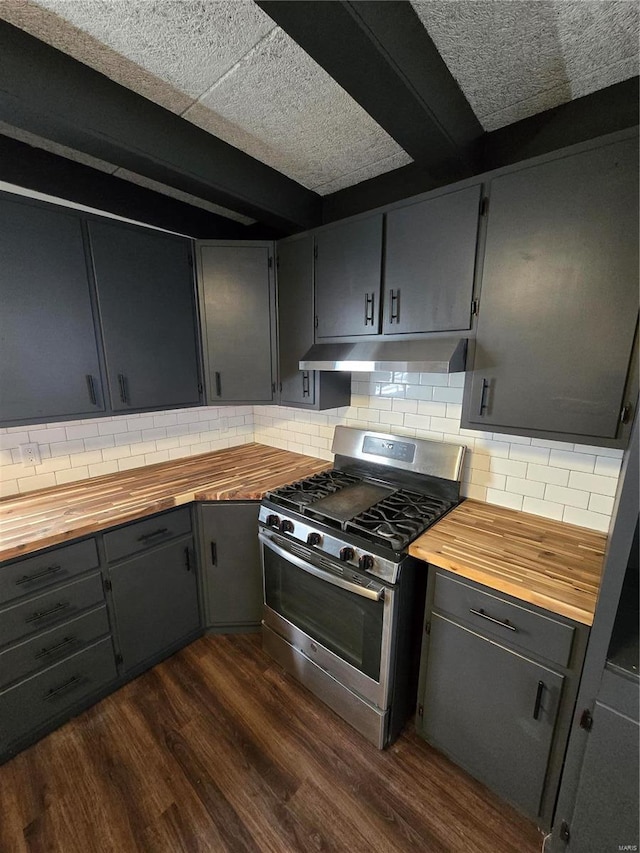 kitchen with wood counters, decorative backsplash, dark hardwood / wood-style flooring, and stainless steel range with gas stovetop