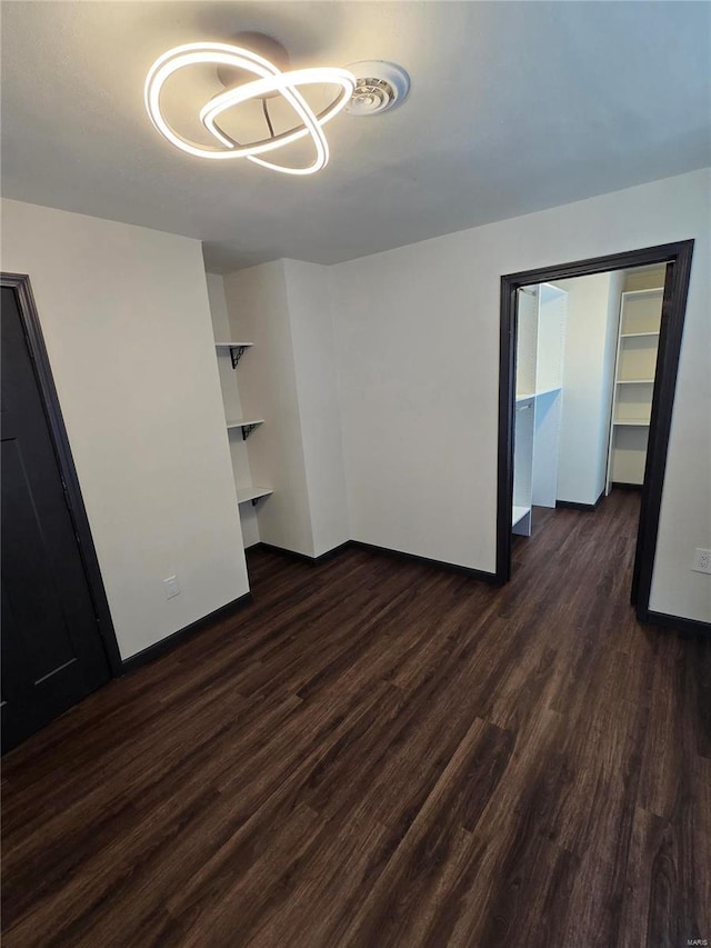 empty room with dark wood-type flooring