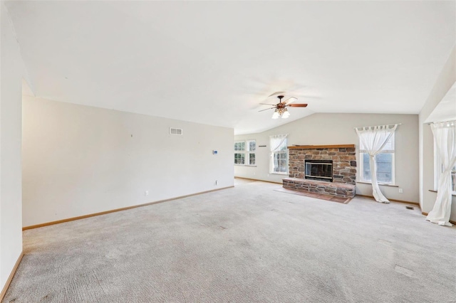 unfurnished living room with ceiling fan, vaulted ceiling, and light carpet