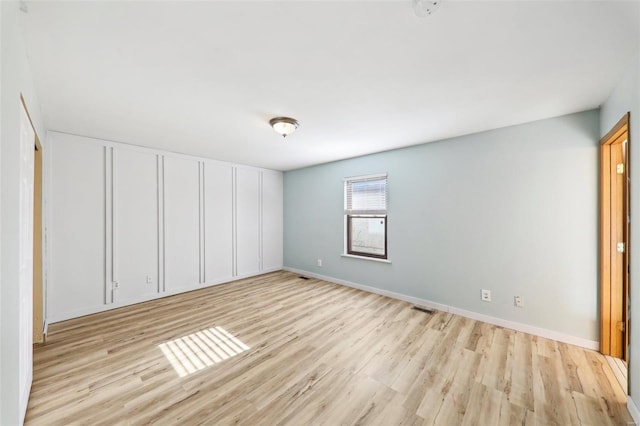 unfurnished bedroom featuring light hardwood / wood-style flooring