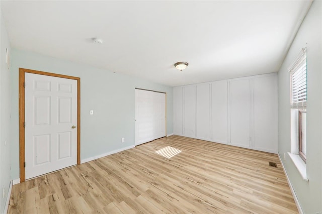 unfurnished room featuring light wood-type flooring