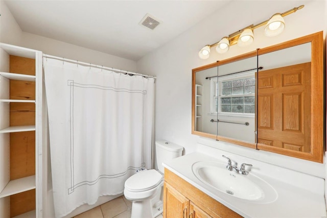 bathroom with tile patterned flooring, vanity, a shower with curtain, and toilet