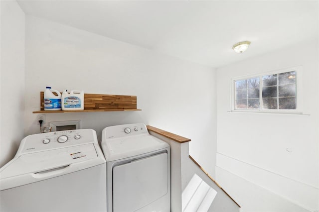 washroom with independent washer and dryer