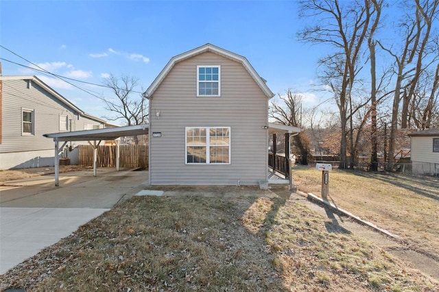 view of side of home with a yard