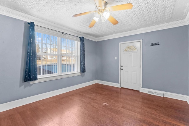 unfurnished room featuring ornamental molding, hardwood / wood-style floors, and ceiling fan